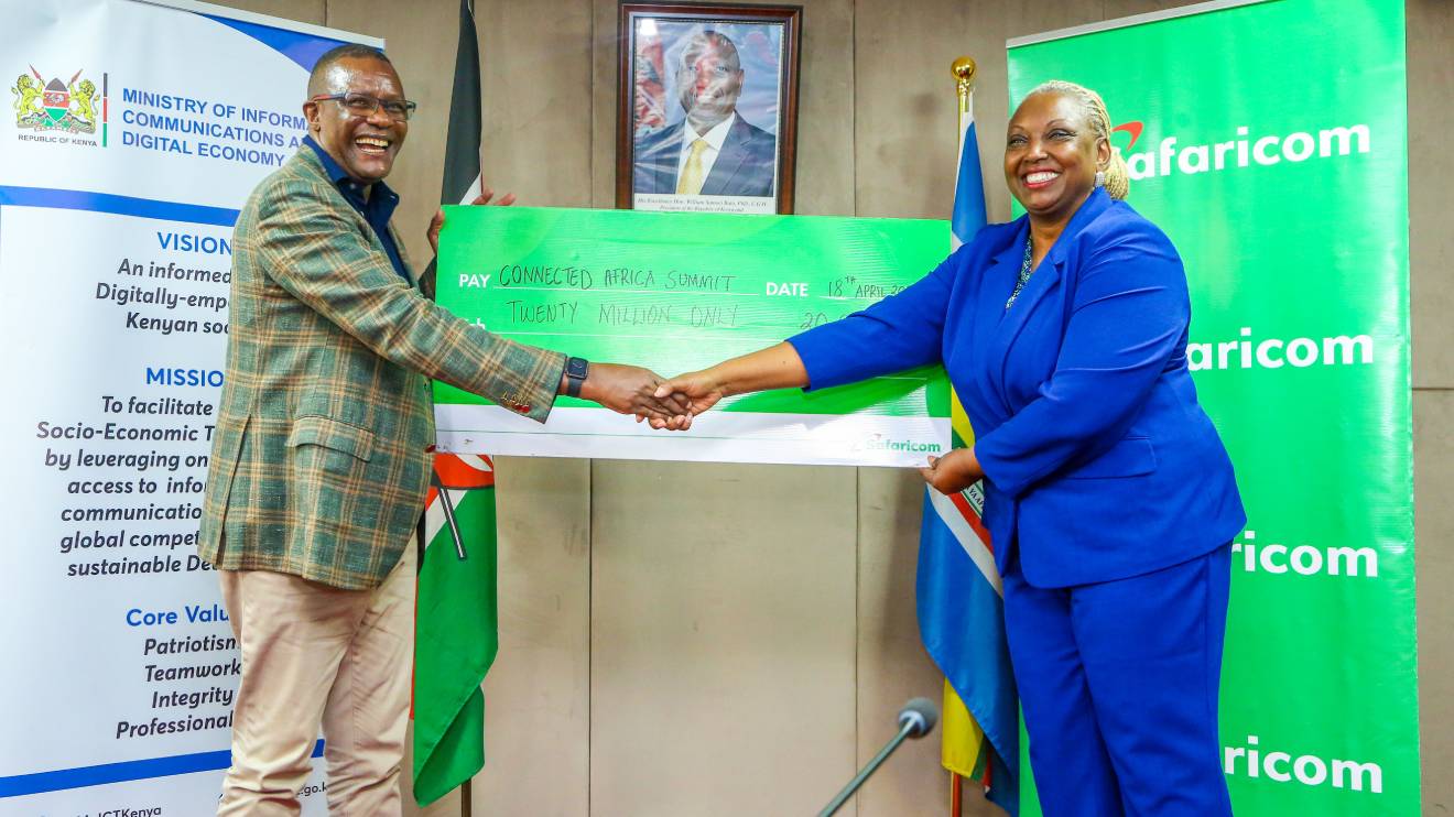 Cynthia Kropac, Chief Enterprise Business Officer, hands over a Sh20 million dummy cheque to ICT CS Eliud Owalo as part of Safaricom support to the Africa Connected summit 2024. PHOTO/COURTESY
